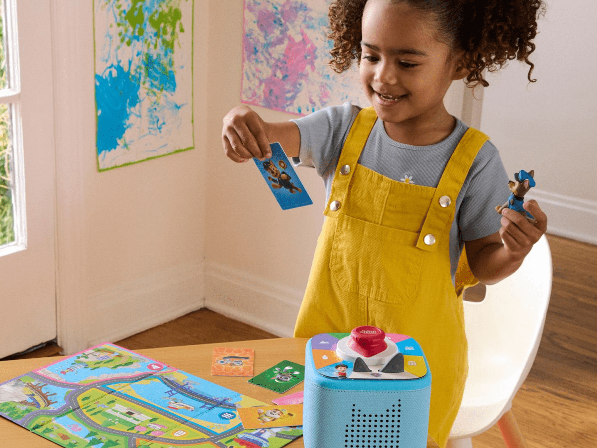 child playing with Toniebox 2 Play Set - PAW Patrol Chase and Tonieplay Sky Blue with controller