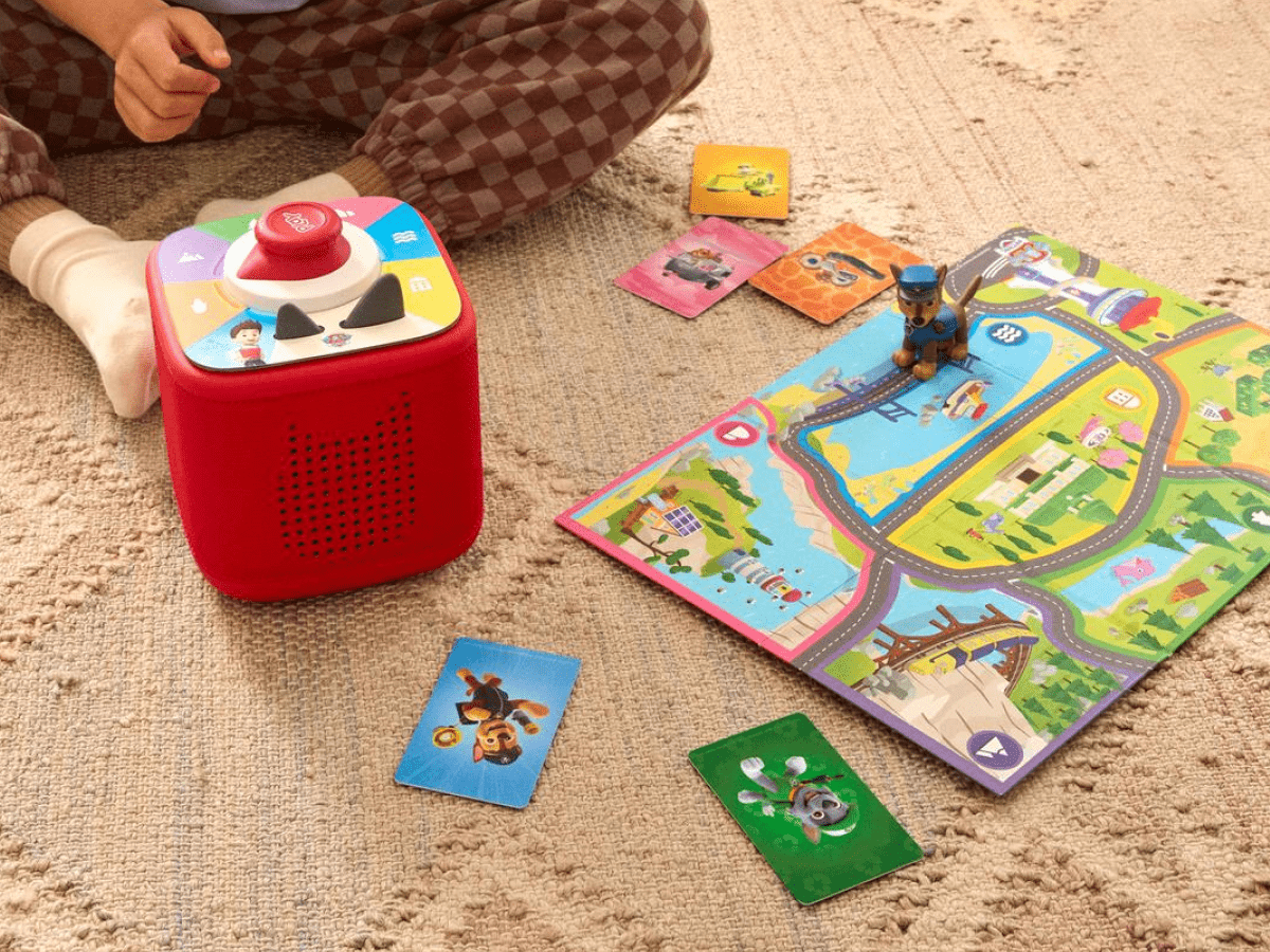 child playing with
Toniebox 2 Play Set - PAW Patrol and a red toniebox with controller