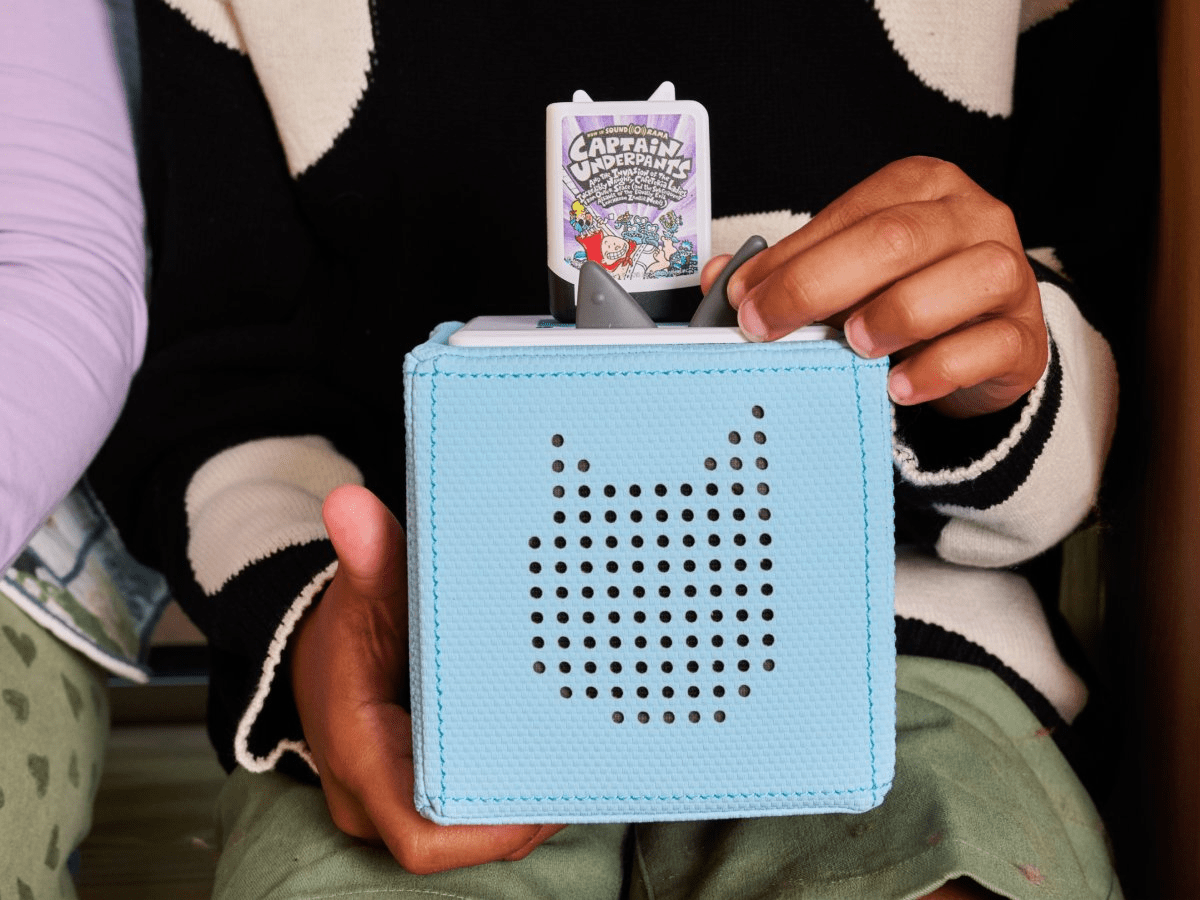 Child playing with Dav Pilkey: Captain Underpants and the Invasion of the Incredibly Naughty Cafeteria Ladies from Outer Space Audiobook
