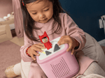 child playing with red creative-tonie on a toniebox 2, an audio player for kids