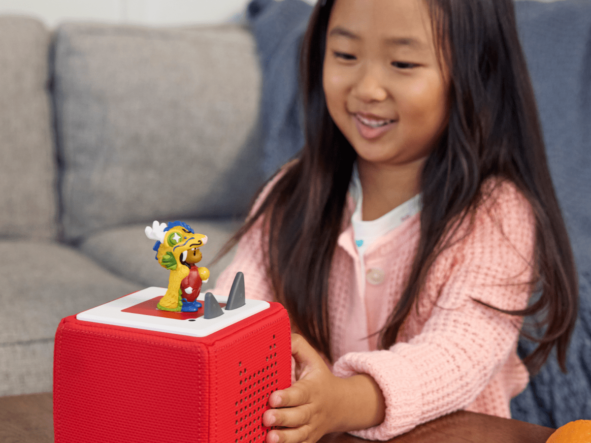 Child Playing With Lunar New Year Audio Figurine And Toniebox 2
