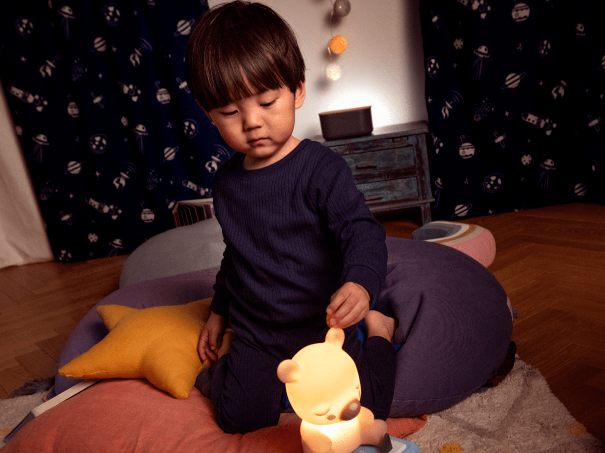 Lifestyle Image of child using Sleepy Friends: Sleepy Bear Night Light Tonie